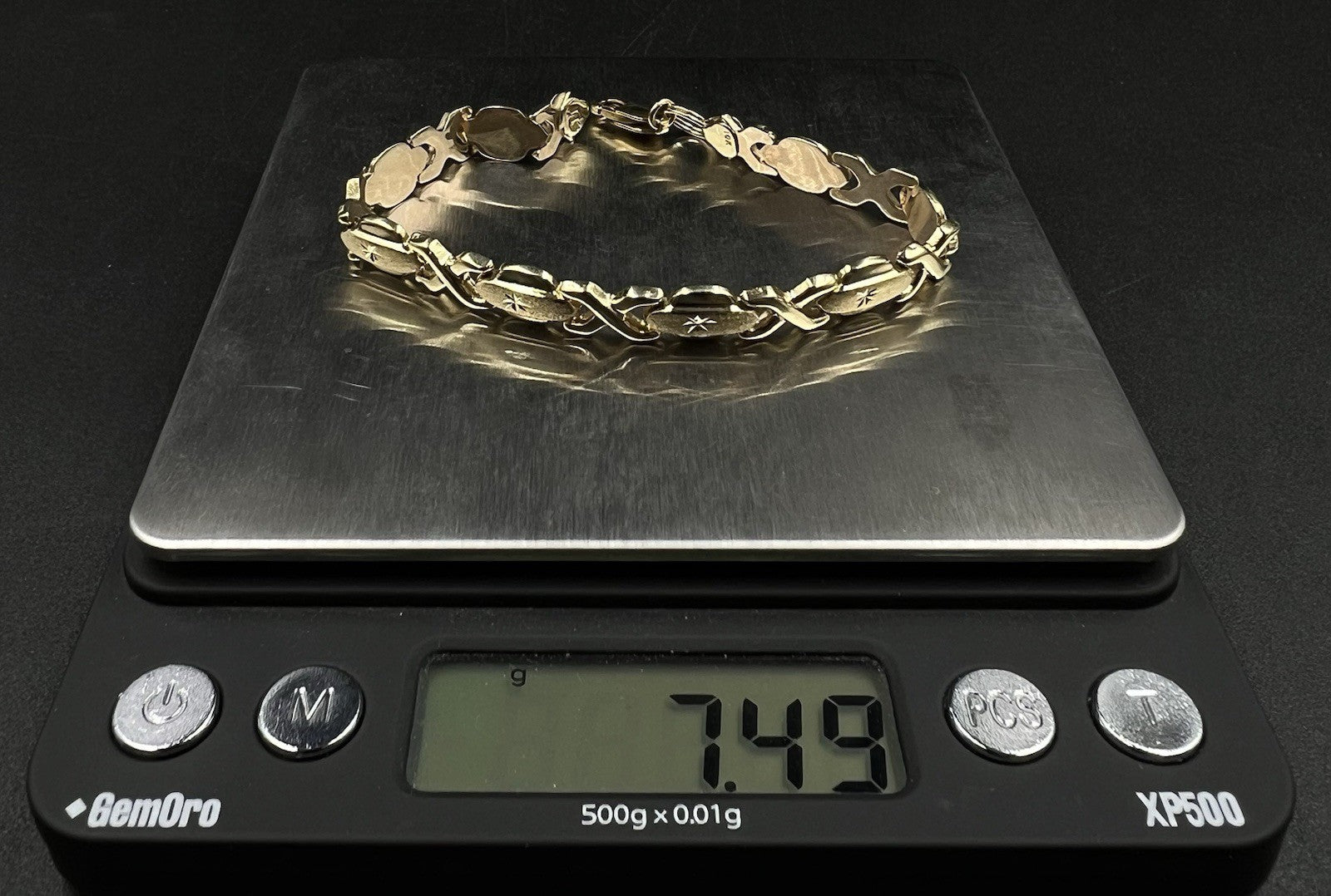 7.25” 10K Hollow Yellow Gold XO Bracelet | 7.49g | 7.2MM | Lobster Clasp |